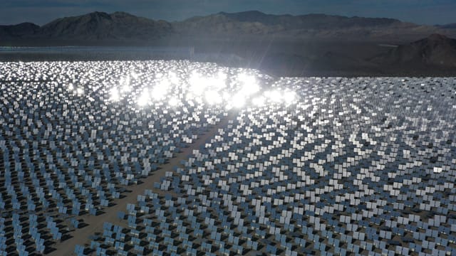 Sun reflects off solar panels in California